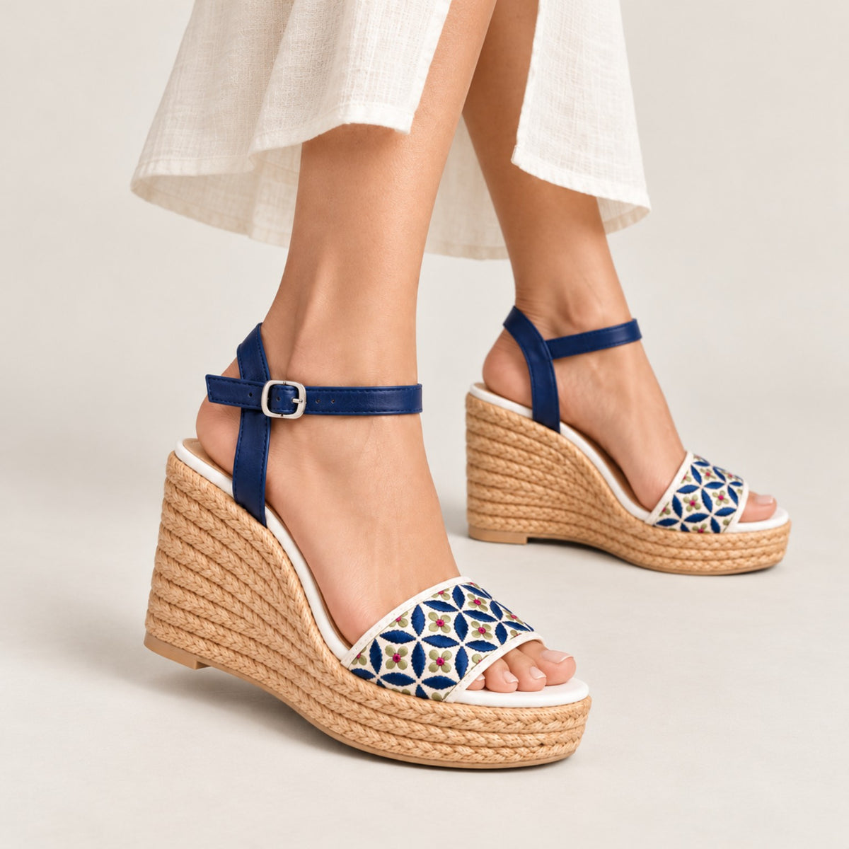 Azulée 100 navy floral wedge sandals styled on feet