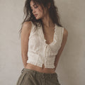 Odette Broderie Top ivory floral eyelet embroidered top with pintucks and ruffled neckline on model