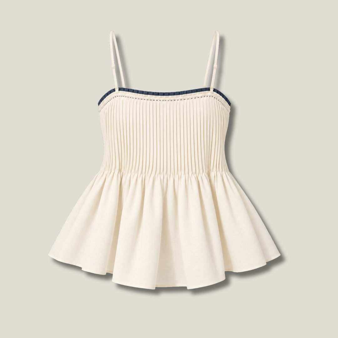 Pleated Cami Ivory back view with adjustable straps, vertical pleats and flared peplum